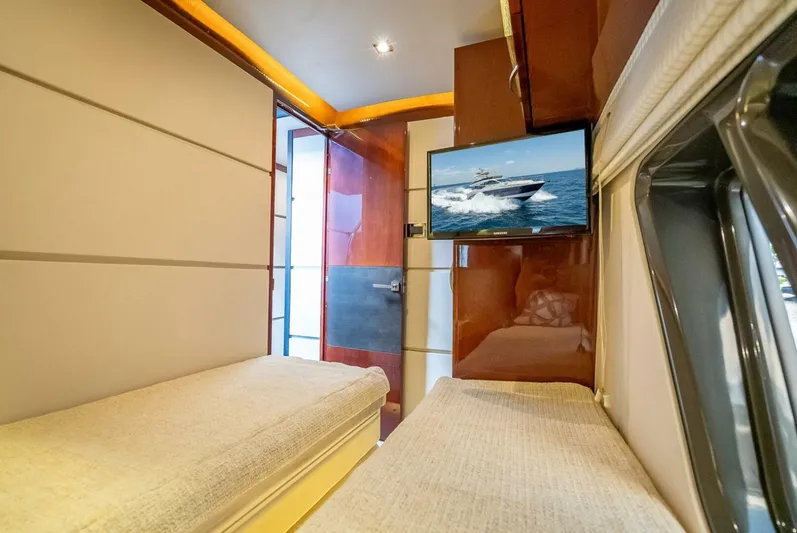  Yacht Photos Pics Luxurious interior of 2016 Sea Ray L650 Fly yacht with twin beds and TV.