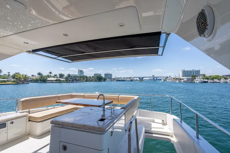  Yacht Photos Pics Luxurious 2016 Sea Ray L650 Fly yacht with spacious deck and scenic waterfront view.