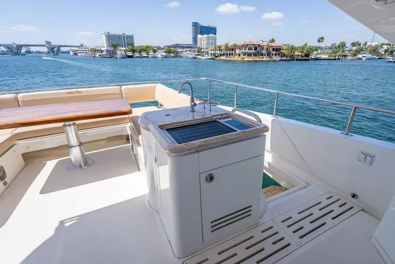  Yacht Photos Pics 2016 Sea Ray L650 Fly yacht deck with sink, seating, and scenic waterfront view.