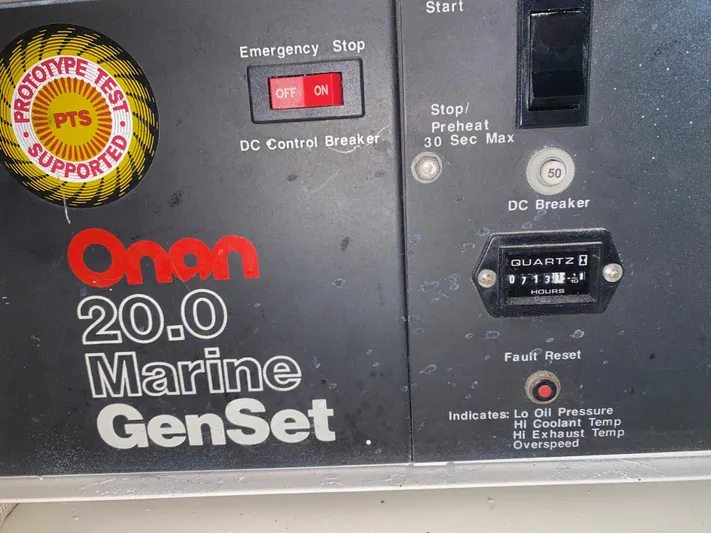 Mad East Yacht Photos Pics Onan 20.0 Marine GenSet control panel with emergency stop and fault reset features.