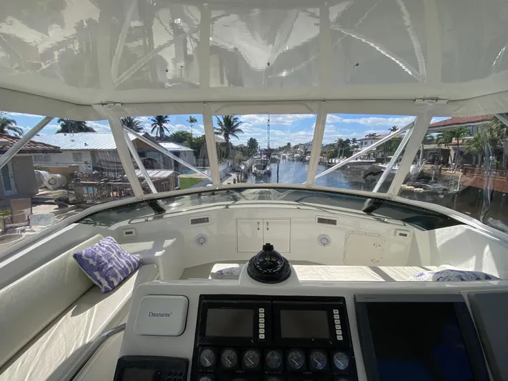 Mad East Yacht Photos Pics Interior view of 1993 Hatteras 54 Convertible yacht cockpit with navigation equipment.