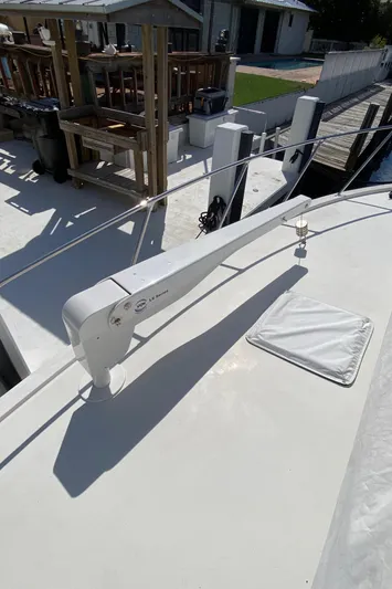 Mad East Yacht Photos Pics 1993 Hatteras 54 Convertible yacht deck with davit and hatch.