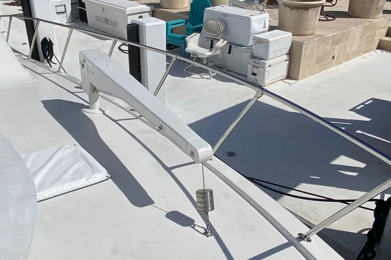 Mad East Yacht Photos Pics 1993 Hatteras 54 Convertible yacht deck with railing and equipment.