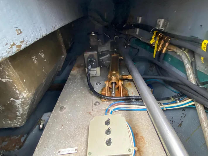 Mad East Yacht Photos Pics Engine room of 1993 Hatteras Convertible boat, showing mechanical components and wiring.