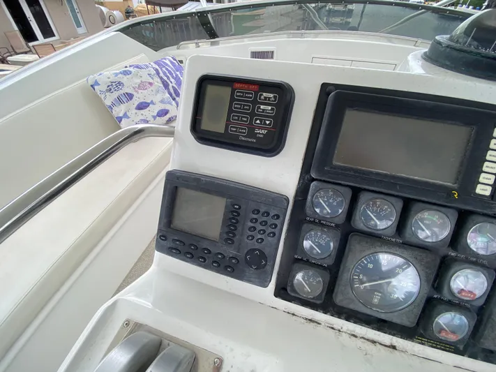 Mad East Yacht Photos Pics 1993 Hatteras Convertible boat dashboard with navigation instruments and gauges.