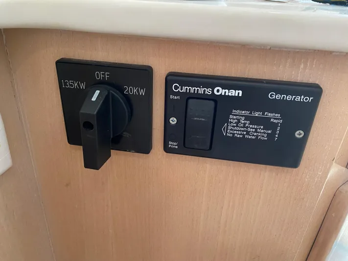 Mad East Yacht Photos Pics Control panel of a 1993 Hatteras Convertible with Cummins Onan generator switches.