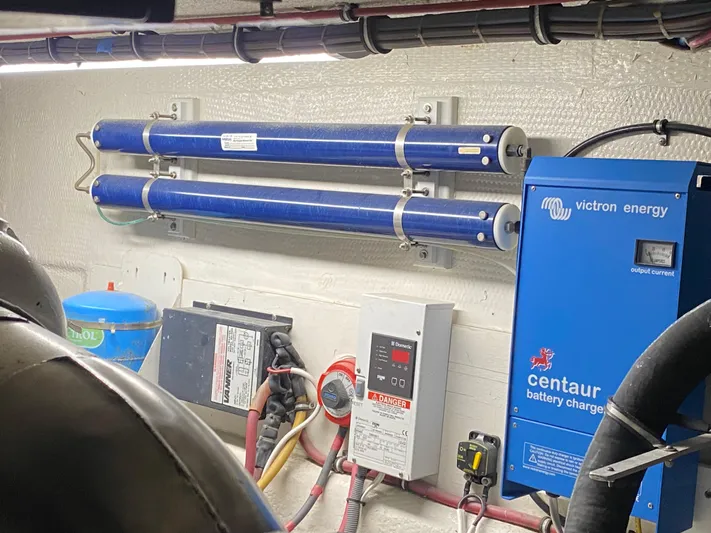 Mad East Yacht Photos Pics Engine room of 1993 Hatteras Convertible with Victron Energy Centaur battery charger.