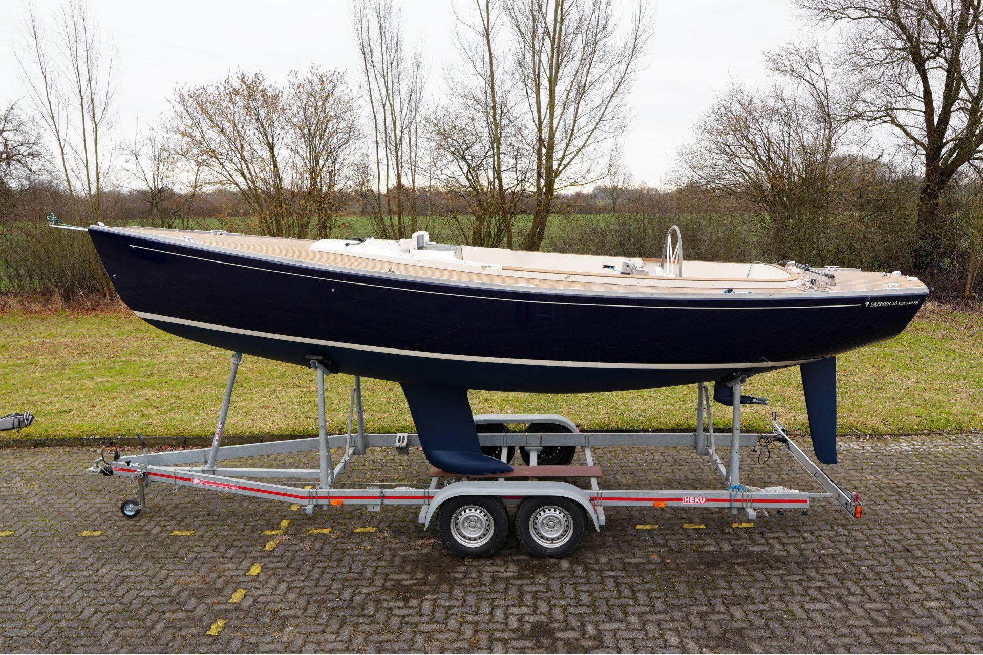 2010 Saffier Se 26 sailboat on trailer, parked outdoors.