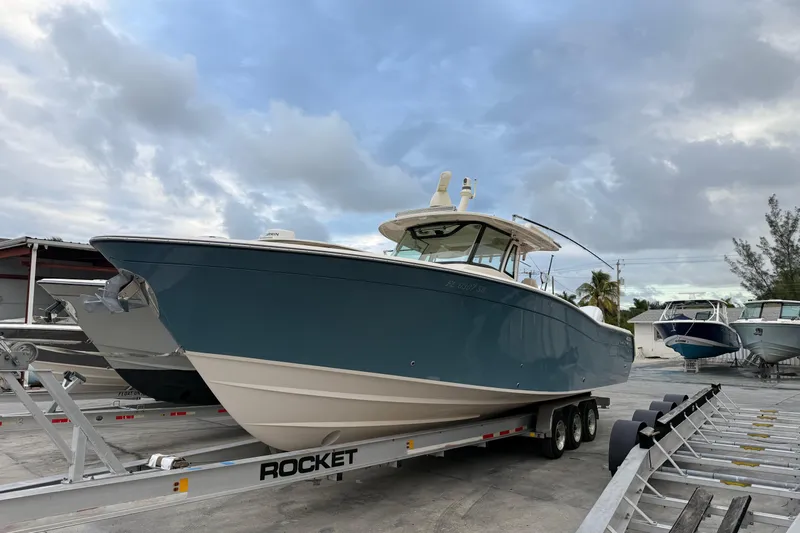 376-420 Brokerage Tyler Yacht Photos Pics 2020 Grady-White Canyon 376 boat on trailer under cloudy sky.