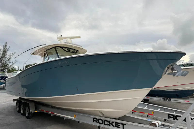 376-420 Brokerage Tyler Yacht Photos Pics 2020 Grady-White Canyon 376 boat on trailer, overcast sky background.