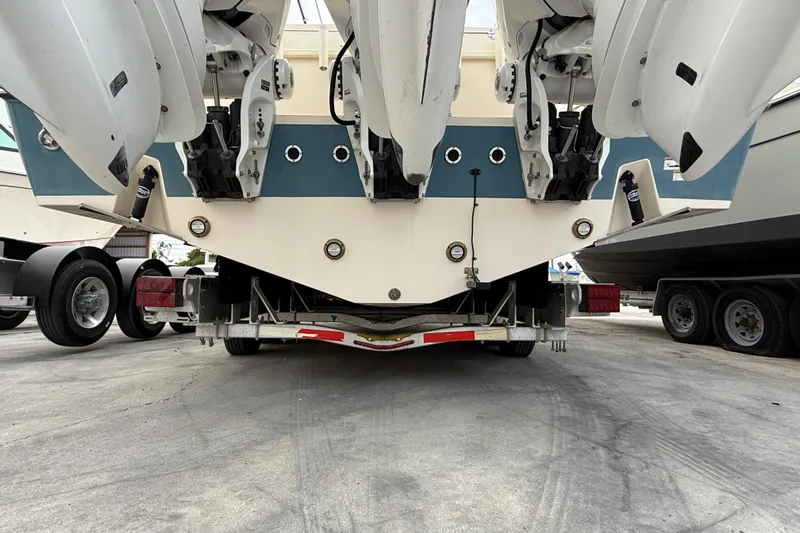 376-420 Brokerage Tyler Yacht Photos Pics 2020 Grady-White Canyon 376 boat on trailer, rear view showing multiple outboard engines.