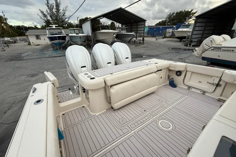 376-420 Brokerage Tyler Yacht Photos Pics 2020 Grady-White Canyon 376 boat with triple outboard engines in a marina setting.
