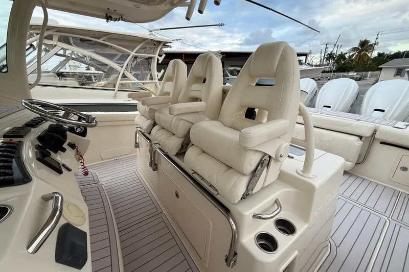 376-420 Brokerage Tyler Yacht Photos Pics Luxury seating on 2020 Grady-White Canyon 376 boat, featuring helm and controls.