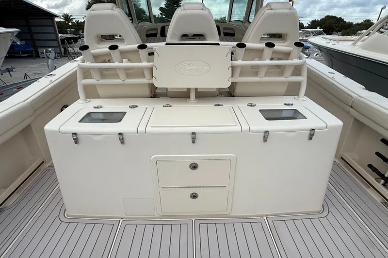 376-420 Brokerage Tyler Yacht Photos Pics 2020 Grady-White Canyon 376 boat interior with fishing rod holders and storage compartments.