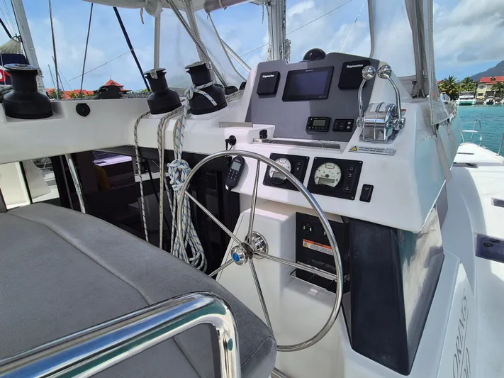 Takamaka Yacht Photos Pics Helm of a 2020 Leopard 50 yacht with navigation controls and steering wheel.