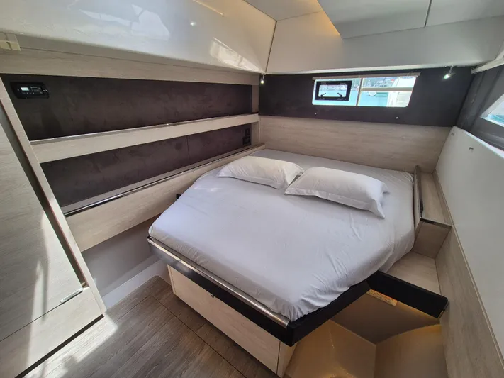 Takamaka Yacht Photos Pics Luxurious bedroom interior of 2020 Leopard 50 yacht with modern design and cozy bedding.