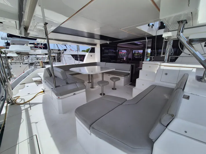 Takamaka Yacht Photos Pics Spacious Leopard 50 yacht interior with modern seating and dining area, 2020 model.