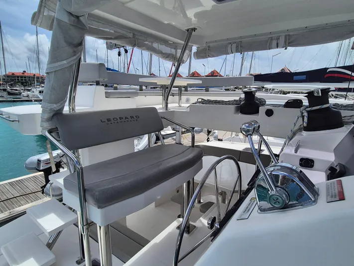 Takamaka Yacht Photos Pics Helm station of 2020 Leopard 50 catamaran with modern controls and seating.