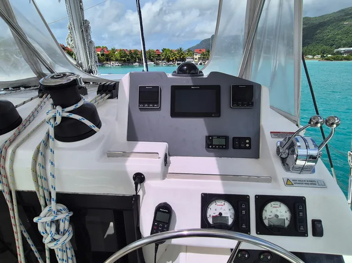 Takamaka Yacht Photos Pics Control panel of a 2020 Leopard 50 yacht with ocean and island view.