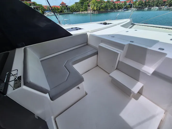 Takamaka Yacht Photos Pics 2020 Leopard 50 yacht seating area with waterfront view.