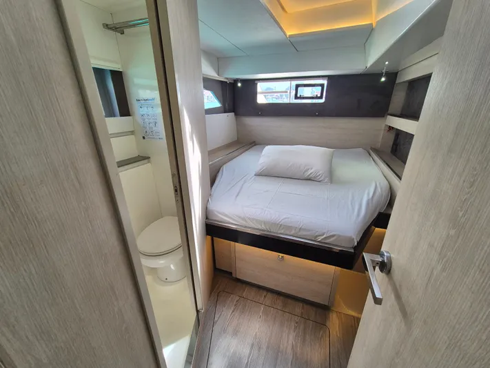 Takamaka Yacht Photos Pics Modern bedroom and bathroom interior on a 2020 Leopard 50 yacht.