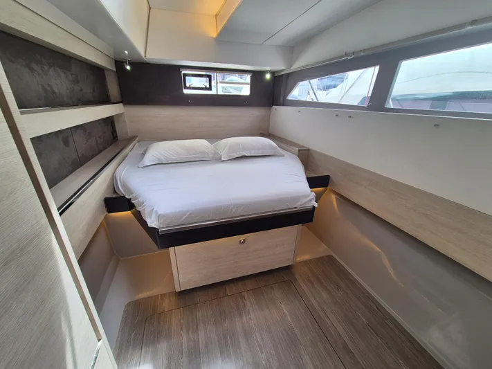 Takamaka Yacht Photos Pics Luxurious cabin interior of a 2020 Leopard 50 yacht with modern design and comfortable bedding.