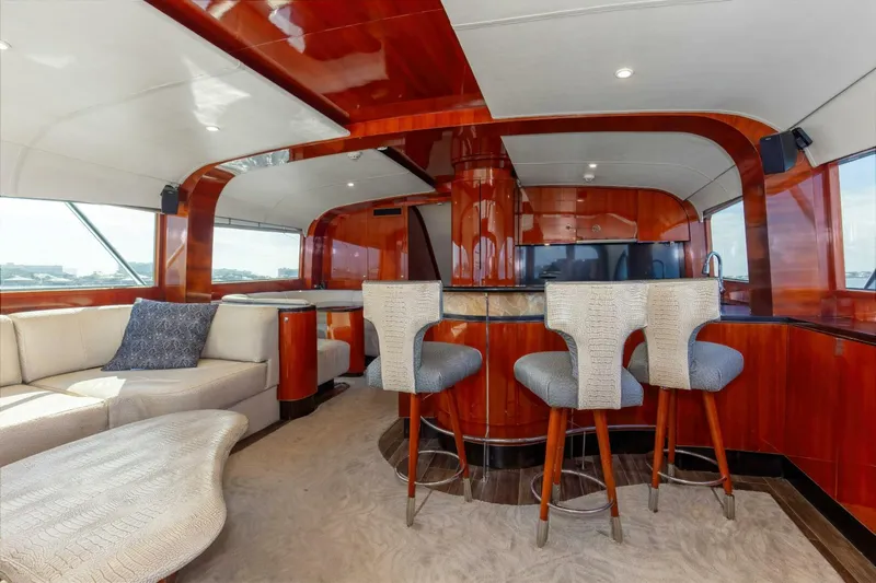 Patron Yacht Photos Pics Luxurious interior of 2004 Custom Ebony Sportfish 65' CNV yacht with elegant wood finishes.