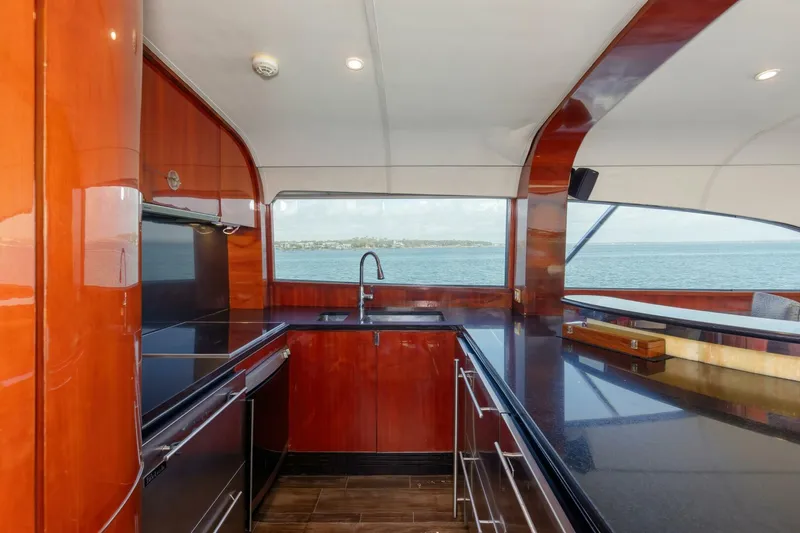 Patron Yacht Photos Pics Luxurious kitchen interior of 2004 Custom Ebony Sportfish 65' CNV yacht with ocean view.