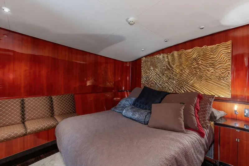 Patron Yacht Photos Pics Luxurious bedroom interior on 2004 Custom Ebony Sportfish 65' CNV yacht.