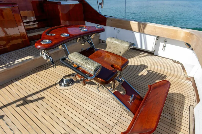 Patron Yacht Photos Pics Luxurious fishing chair on 2004 Custom Ebony Sportfish 65' CNV yacht deck.