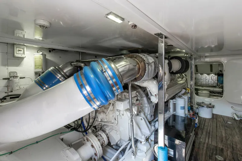 Patron Yacht Photos Pics Engine room of 2004 Custom Ebony Sportfish 65' CNV yacht, showcasing machinery and components.