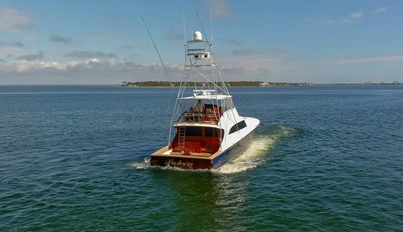 Patron Yacht Photos Pics Custom Ebony Sportfish 65' CNV yacht cruising on open water, 2004 model.
