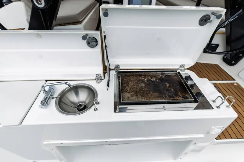 Dotwick Jinga Yacht Photos Pics Outdoor kitchen on 2020 Dufour 360 yacht with sink and grill.