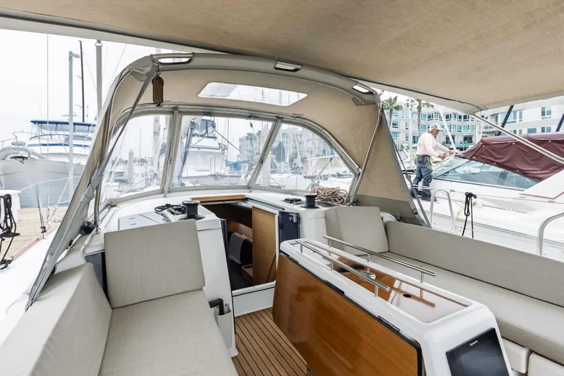 Dotwick Jinga Yacht Photos Pics 2020 Dufour 360 yacht interior with seating, docked at marina.