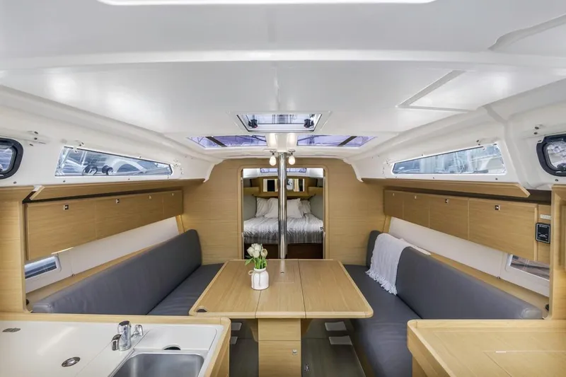 Dotwick Jinga Yacht Photos Pics Interior of 2020 Dufour 360 sailboat, featuring modern dining area and cozy cabin.