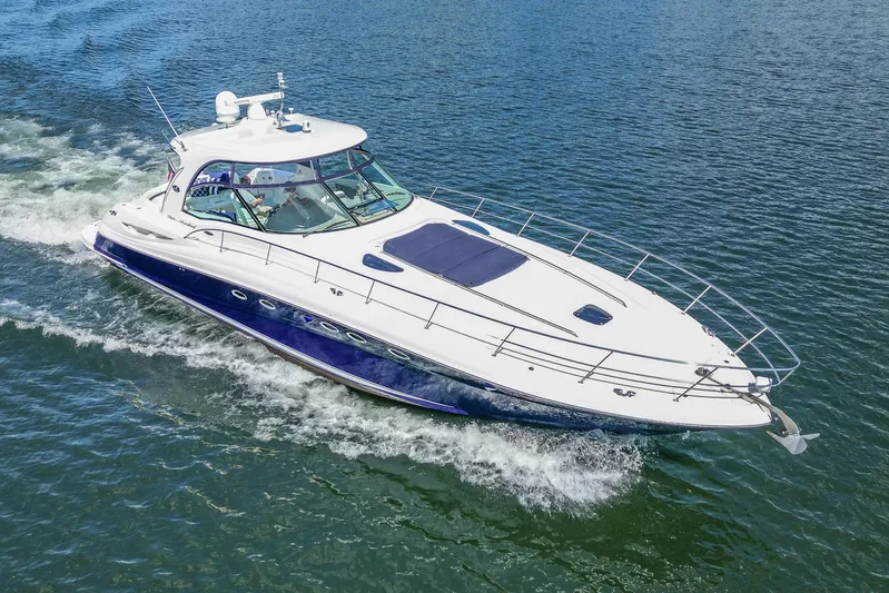 Night Moves Yacht Photos Pics 2005 Sea Ray 500 Sundancer yacht cruising on open water.