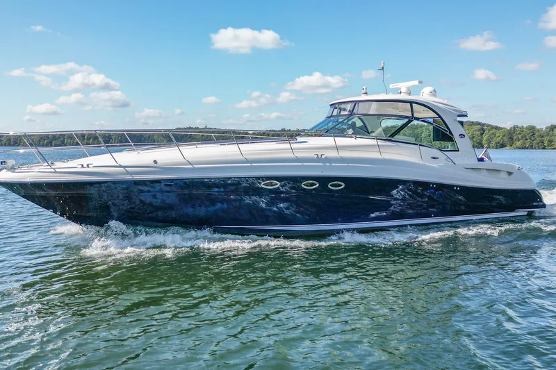 Night Moves Yacht Photos Pics 2005 Sea Ray 500 Sundancer yacht cruising on a sunny day with clear skies.