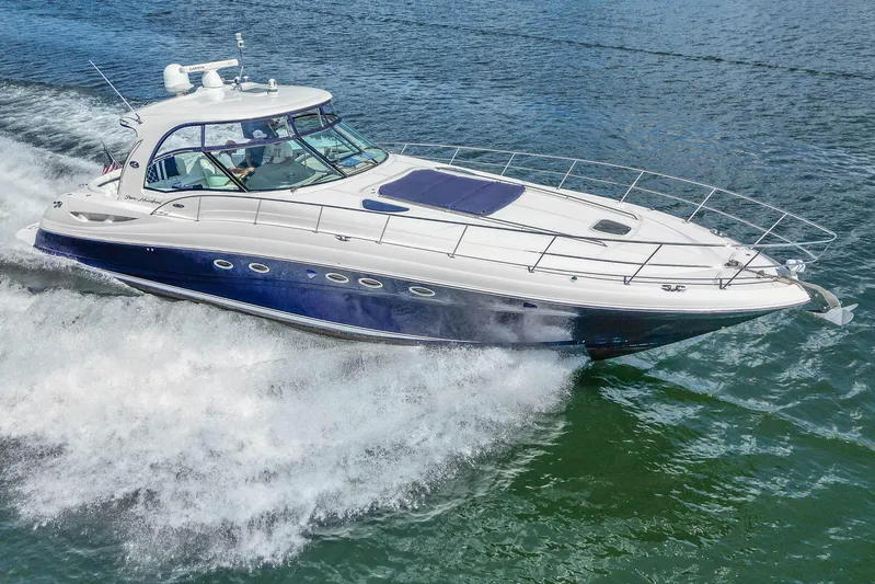 Night Moves Yacht Photos Pics 2005 Sea Ray 500 Sundancer yacht cruising on open water, showcasing sleek design and performance.