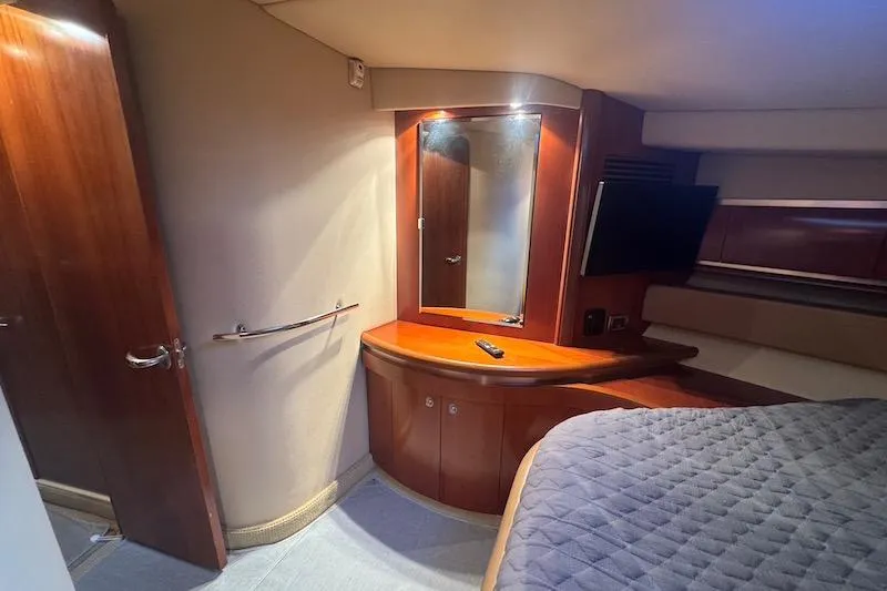 Night Moves Yacht Photos Pics Luxurious cabin interior of 2005 Sea Ray 500 Sundancer yacht with wood finishes.