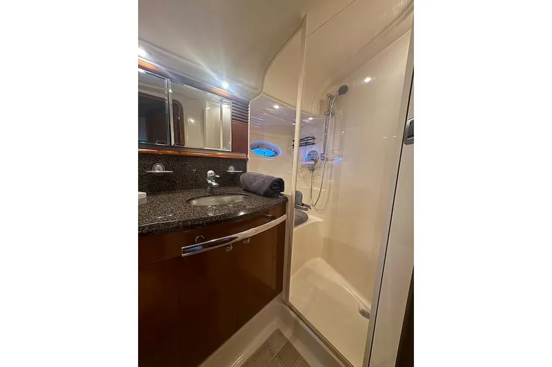 Night Moves Yacht Photos Pics Luxurious bathroom in 2005 Sea Ray 500 Sundancer yacht with modern fixtures and shower.