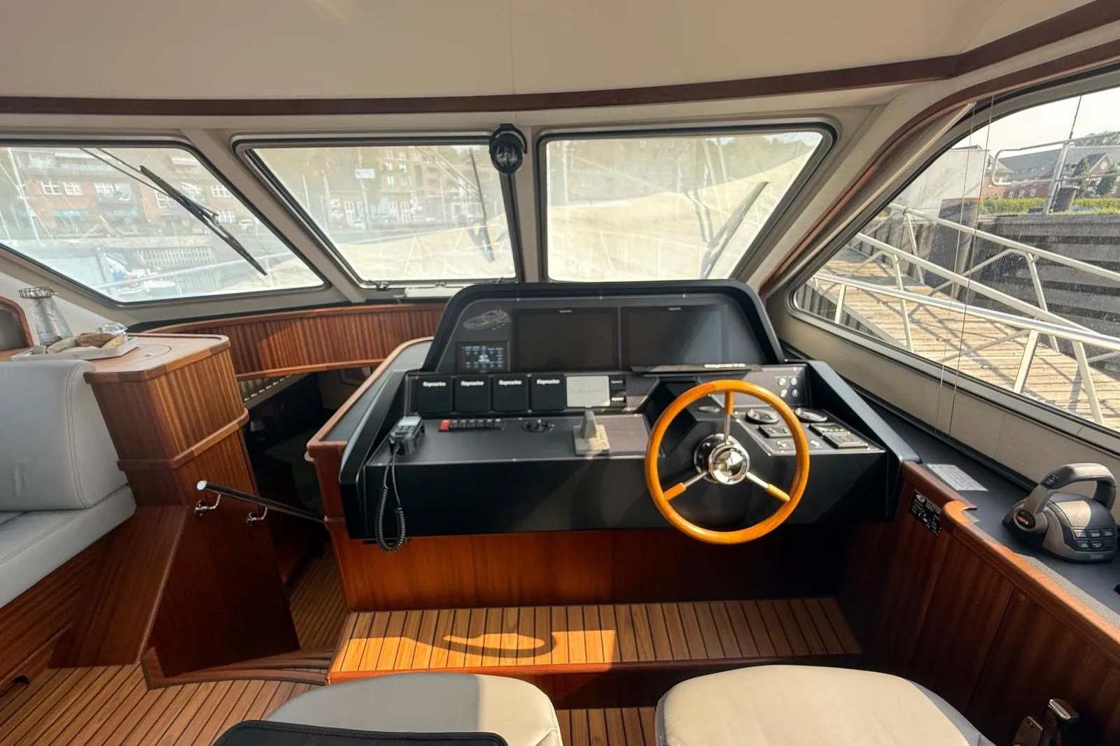 2023 Elling E6 yacht interior with modern helm and wooden accents.