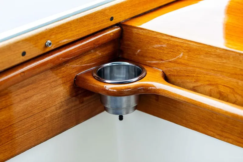 Belle Yacht Photos Pics Polished wood detail with cup holder on 1998 Hinckley Picnic Boat.