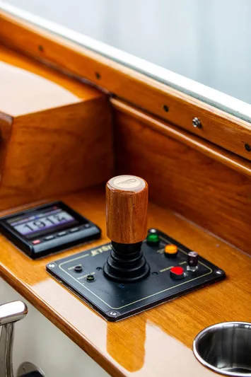 Belle Yacht Photos Pics 1998 Hinckley Picnic Boat control panel with joystick and display, featuring wooden finish.