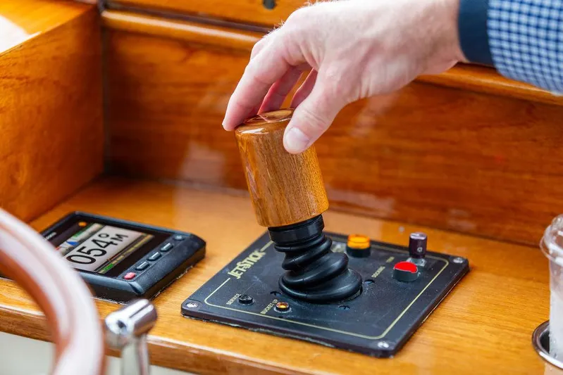 Belle Yacht Photos Pics Hand operating joystick on 1998 Hinckley Picnic Boat control panel.