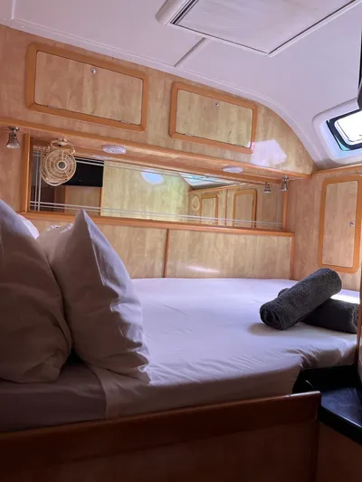  Yacht Photos Pics Luxurious cabin interior of 2012 Royal Cape Catamarans Majestic 53 with cozy bedding.
