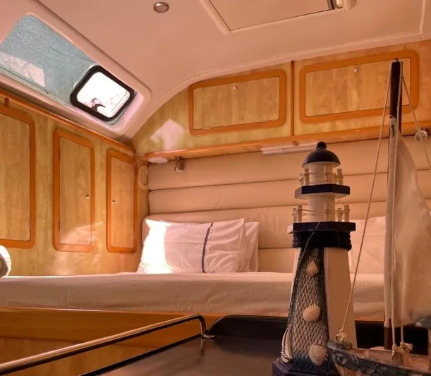  Yacht Photos Pics Luxurious cabin interior of 2012 Royal Cape Catamarans Majestic 53 with nautical decor.