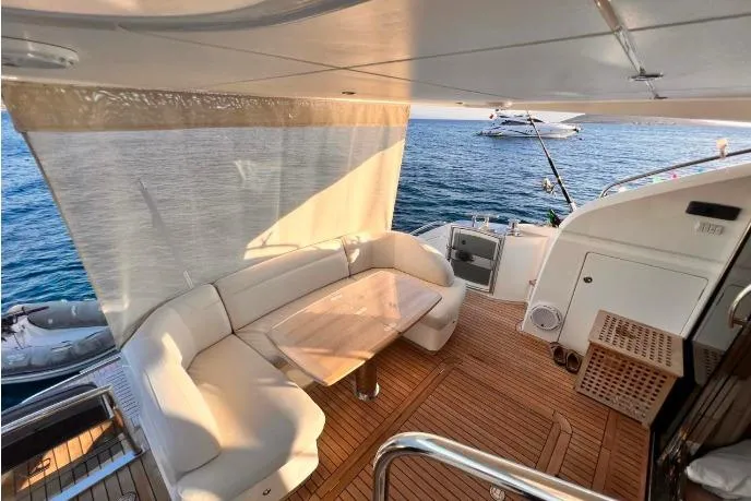  Yacht Photos Pics Luxurious 2015 Princess Flybridge 52 Motor Yacht with elegant deck seating and ocean view.