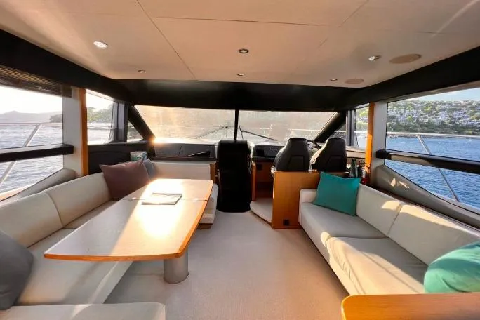  Yacht Photos Pics Luxurious interior of 2015 Princess Flybridge 52 Motor Yacht with elegant seating and panoramic views.