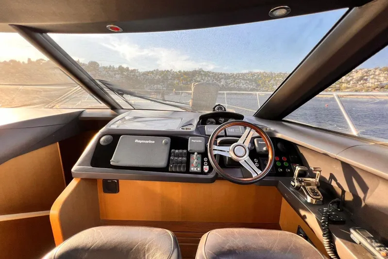  Yacht Photos Pics Helm of 2015 Princess Flybridge 52 Motor Yacht with Raymarine navigation system.