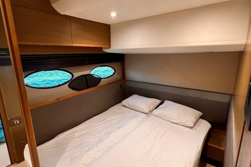  Yacht Photos Pics Luxurious cabin interior of 2015 Princess Flybridge 52 Motor Yacht with ocean view windows.